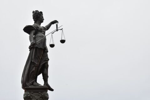 Lady Justice statue with scales — Photo by Gaétan Marceau Caron on Unsplash