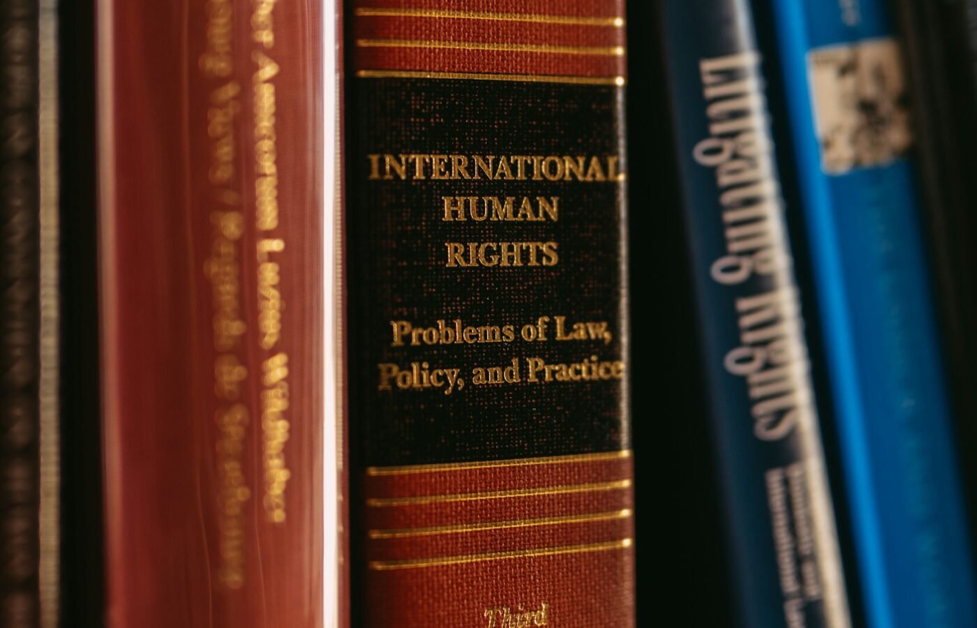 Books on law and human rights on a shelf